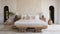 Tranquil White Bedroom With Carved Wood Block And Bamileke Art