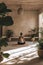 Tranquil yoga setting with woman practicing mindfulness in a sunlit, plant-filled room.