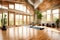 A tranquil yoga studio with bamboo flooring, large windows, and soothing decor for a peaceful practice