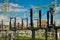 Transformer substation, in the photo substation elements against the background of blue sky and clouds