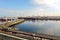 Transhipment terminal for unloading bulk cargo of chemical sulfur from ships using a coastal crane. Port of Zorf-Lasfar, Morocco.