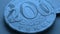 Translation: tenge. Kazakh coins. Blue tinted money wallpaper. Coin 200 tenge closeup. Economy and Central Bank of Kazakhstan.