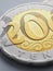 Translation: tenge. Kazakh coins lie on light surface. Coin 200 tenge close-up. Economy and Central Bank of Kazakhstan. National