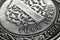 Translation: Turkish lira. Fragment of 1 lira coin close up. National currency of Turkey. Black and white illustration for news