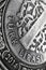 Translation: Turkish lira. Fragment of 1 lira coin close up. National currency of Turkey. Black and white vertical illustration