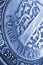 Translation: Turkish lira. Fragment of 1 lira coin close-up. National currency of Turkey. Blue tinted vertical illustration for