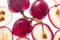 Translucent of ripe red grapes macro. Top view. Background of transparent slices of grapes with pits