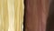 Translucent yellow and burgundy chiffon curtain. Bedroom, cafe or club close-up