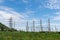 Transmission High voltage electricity pylon with blue sky backgr