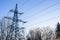 transmission tower of power line in winter