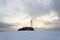 Transmitters and aerials on telecommunication tower, sunset in snowy country