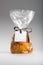Transparent bag of candied apricots with ribbon and blank label