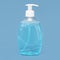 transparent bottle liquid soap blue background. High quality and
