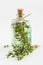 Transparent bottle of thyme essential oil or infusion