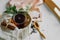 Transparent Cup of tea brewed with adjacent wooden spoons. Cinnamon sticks. Tea time. Tea leafs, Flat Lay