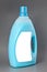 Transparent detergent plastic bottle isolated on gray