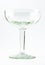 A transparent elegant crystal glass for cocktails on a white background