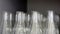 Transparent Erlenmeyer flasks or conical flasks on shelf in science laboratory, use for measuring solvent or solution.