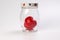 transparent glass jar with lid with three dimension 3d red hart symbol inside on white background copy text space