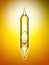 Transparent glass pipette with a Golden liquid dripping