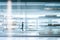 Transparent glass shelves background in store, storage room or office. Blurred people on background