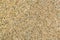 Transparent grains of sand of quartz sand close-up for background or texture.