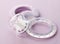 Transparent pacifier on pink background