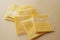 Transparent packet with slices of cheese on yellow ,