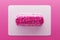 Transparent pill with pink candy hearts