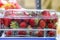 Transparent plastic containers with fresh strawberries. Product on the shelf of a grocery store