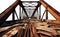 transparent PNG of a Truss Bridge. passageway wood road. rusty steel metal iron.