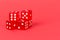 Transparent and red glass dices isolated on red background
