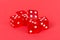 Transparent and red glass dices isolated on red background