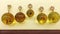 Transparent round amber pendants with insects inside.