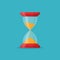 Transparent sandglass icon on blue background. Time hourglass in flat style. Sandclock.