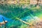 Transparent turquoise water lake with trees submerged at Jiuzhaigou National Park