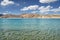 Transparent water and desert hills of high mountain lake