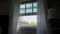 Transparent window curtain, slow moved by the wind