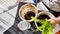 Transplanting a houseplant fern and female hands. A housewife gardener is transplanting plant into new pot