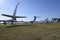 Transport aircrafts and light planes parked in the park of an air show