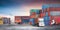 Transport of containers truck at shipping depot dock yard background with container handler forklift, cargo plane, Logistics