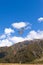 Transport helicopter fly over mountain wilderness