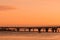 The transport and pedestrian bridges on the Finnish Gulf in Petersburg on the background of sunset