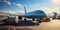 Transport plane at the airport. Workers load goods and cargo onto the plane. Cargo pallets. Air freight