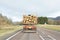 Transport stacked chopped wood logs renewable energy on flat back lorry truck