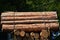 Transport stacked chopped wood logs renewable energy on flat back lorry truck