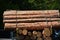 Transport stacked chopped wood logs renewable energy on flat back lorry truck