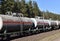 Transport tank car LNG by rail, gas-oil products. LPG transport propane. The fuel train, rolling stock with petrochemical tank