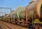 Transport tank car LNG by rail, gas-oil products. LPG transport propane. The fuel train, rolling stock with petrochemical tank