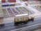 Transport truck moves two containers in the storage area of the Singapore container port